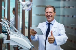 01062026_Happy Dentist on tablet