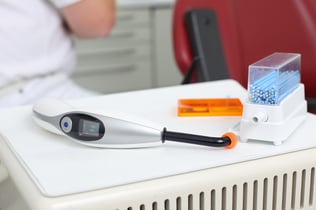 Closeup of dental curing light on tray at clinic