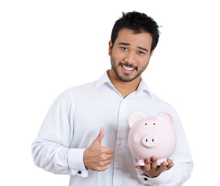 Closeup portrait of young smiling student, worker man holding piggy bank, giving thumbs up, isolated on white background. Smart currency financial investment decisions. Budget management and savings