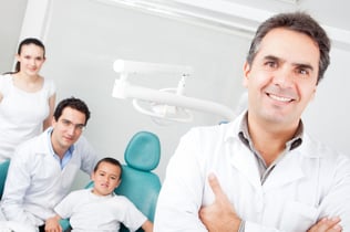 Group of doctors working on dental care with a patient