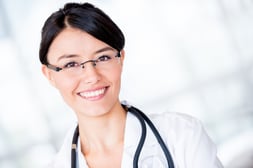 Portrait of a friendly female doctor smiling at the hospital