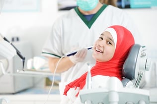 Young teenage girl at dentists office