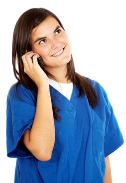 friendly woman doctor smiling on the phone isolated over a white background